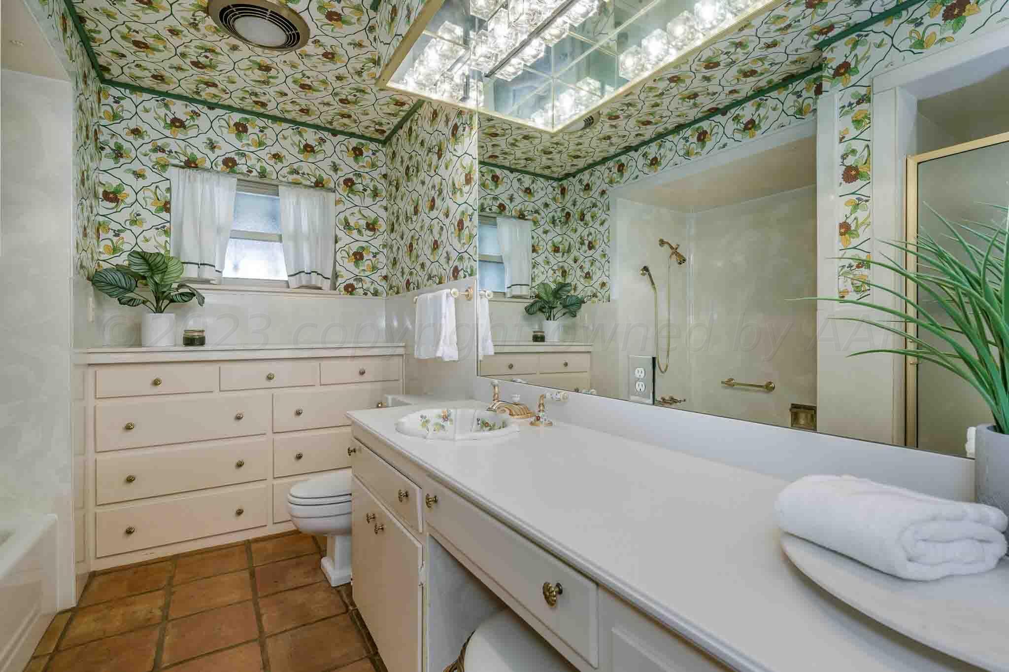 7517 Duling Lane Amarillo, TX 79110 - Photo 33 of 80 a bathroom with a sink and a mirror