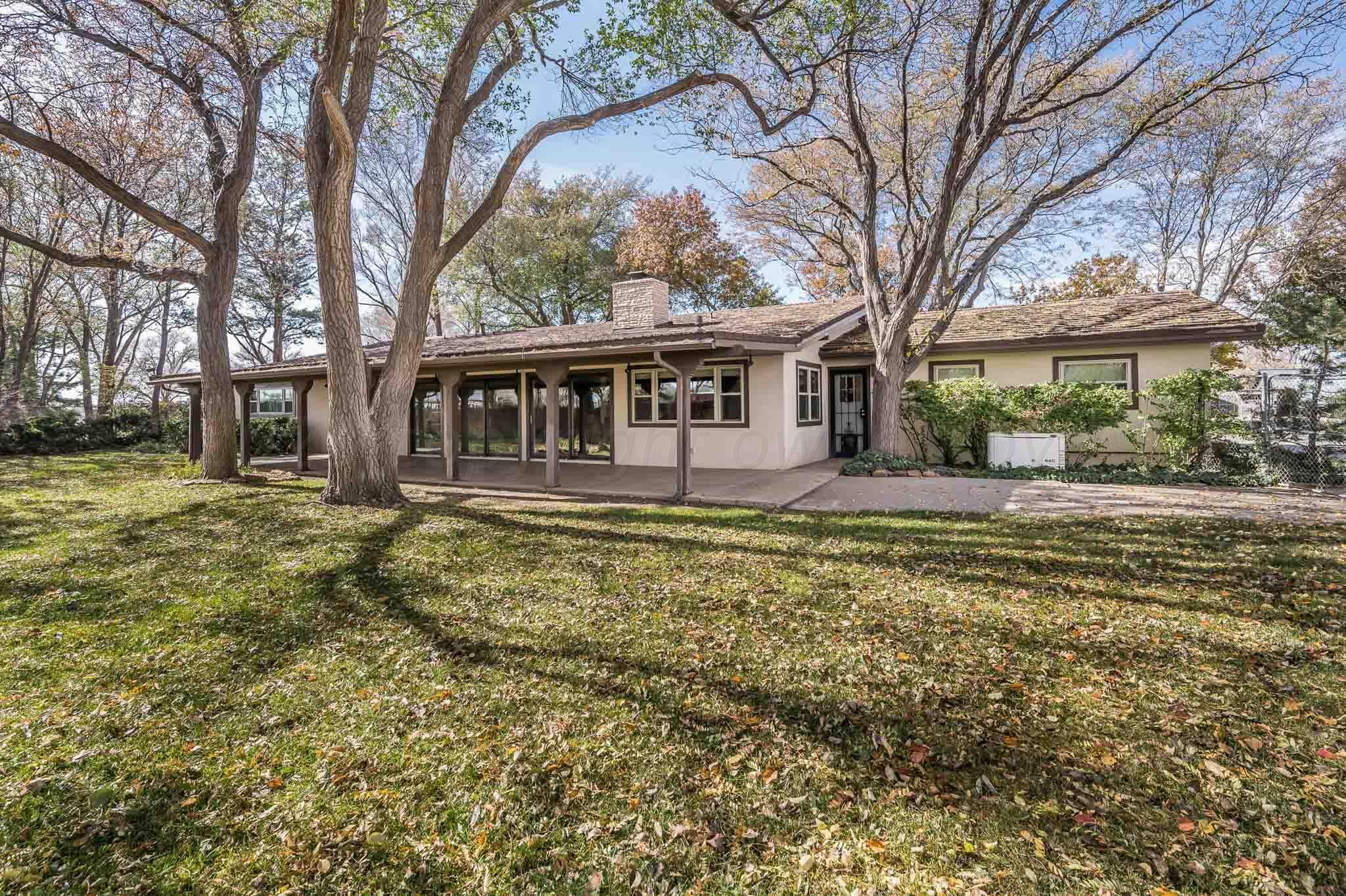 7517 Duling Lane Amarillo, TX 79110 - Photo 36 of 80 a house view with swimming pool in front of it