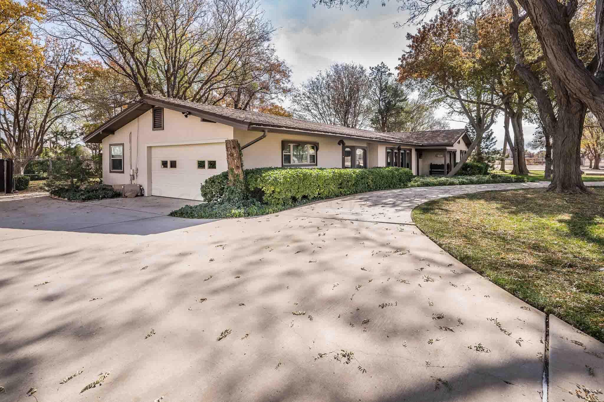 7517 Duling Lane Amarillo, TX 79110 - Photo 37 of 80 a view of a white house with a yard covered with snow