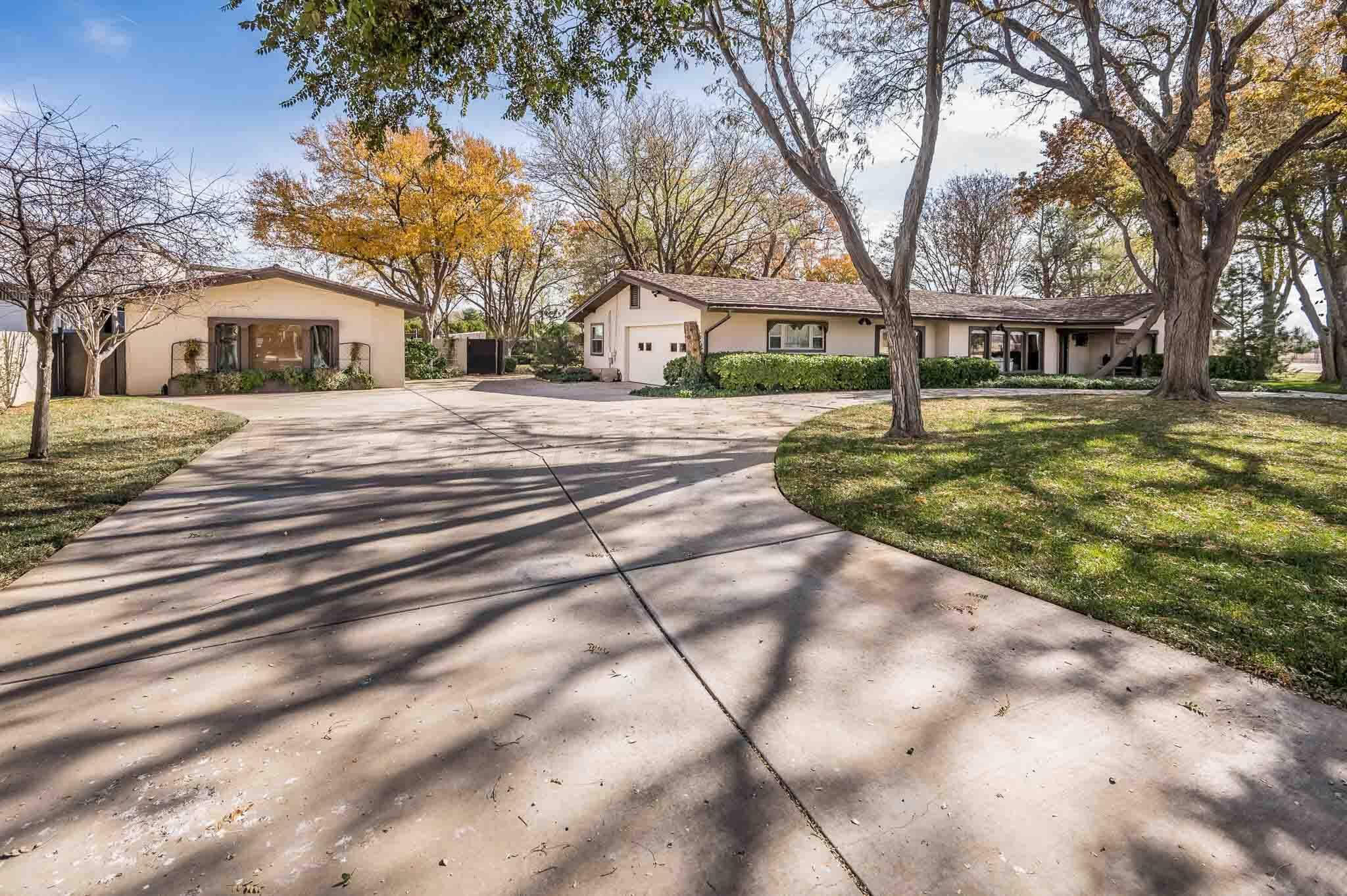 7517 Duling Lane Amarillo, TX 79110 - Photo 38 of 80 a front view of a house with a yard
