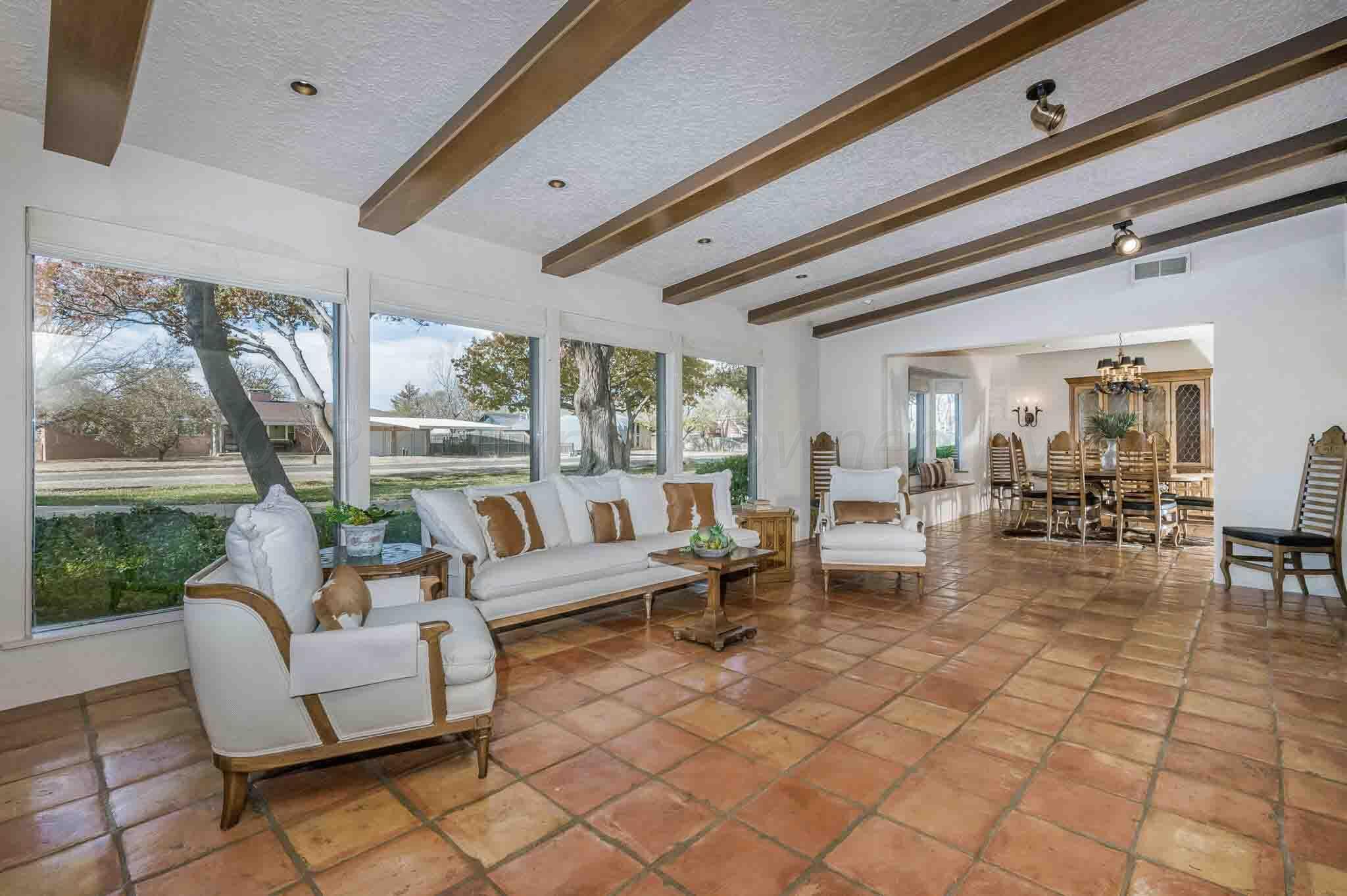 7517 Duling Lane Amarillo, TX 79110 - Photo 10 of 80 a living room with fireplace furniture and a large window