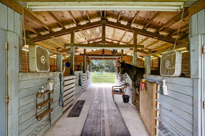 1032 Hyde Park Road Loxahatchee, FL 33470 - Photo 15 of 24 a view of a porch with wooden floor