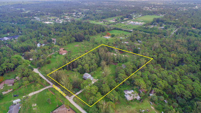 1032 Hyde Park Road Loxahatchee, FL 33470 - Photo 23 of 24 a view of a tennis court
