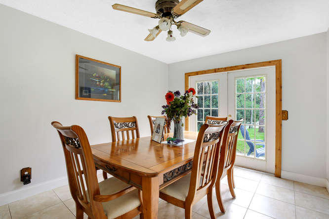1032 Hyde Park Road Loxahatchee, FL 33470 - Photo 4 of 24 a dining room with furniture and window