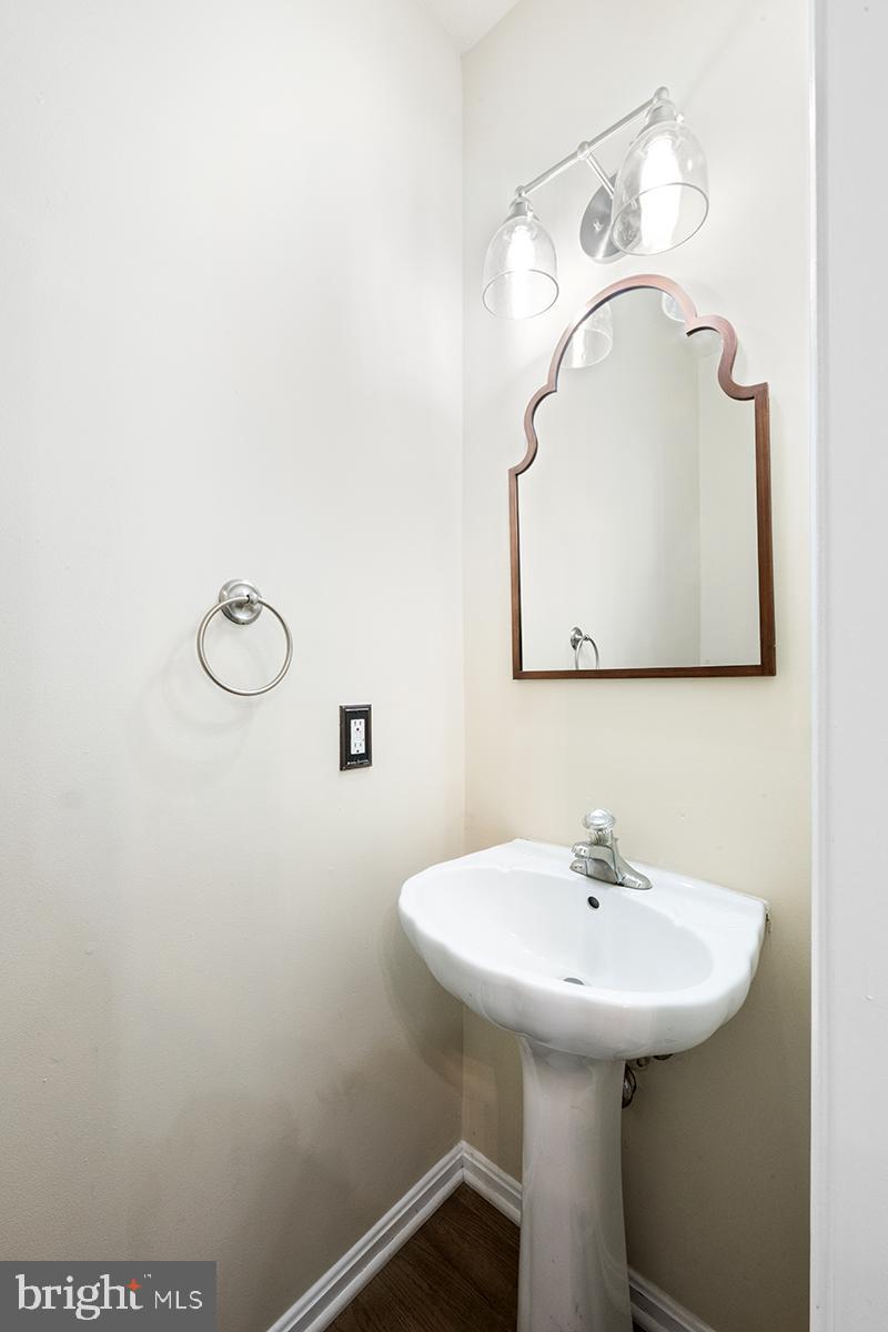 35184 Pheasant Ridge Road Locust Grove, VA 22508 - Photo 31 of 64 a bathroom with a sink a mirror and vanity