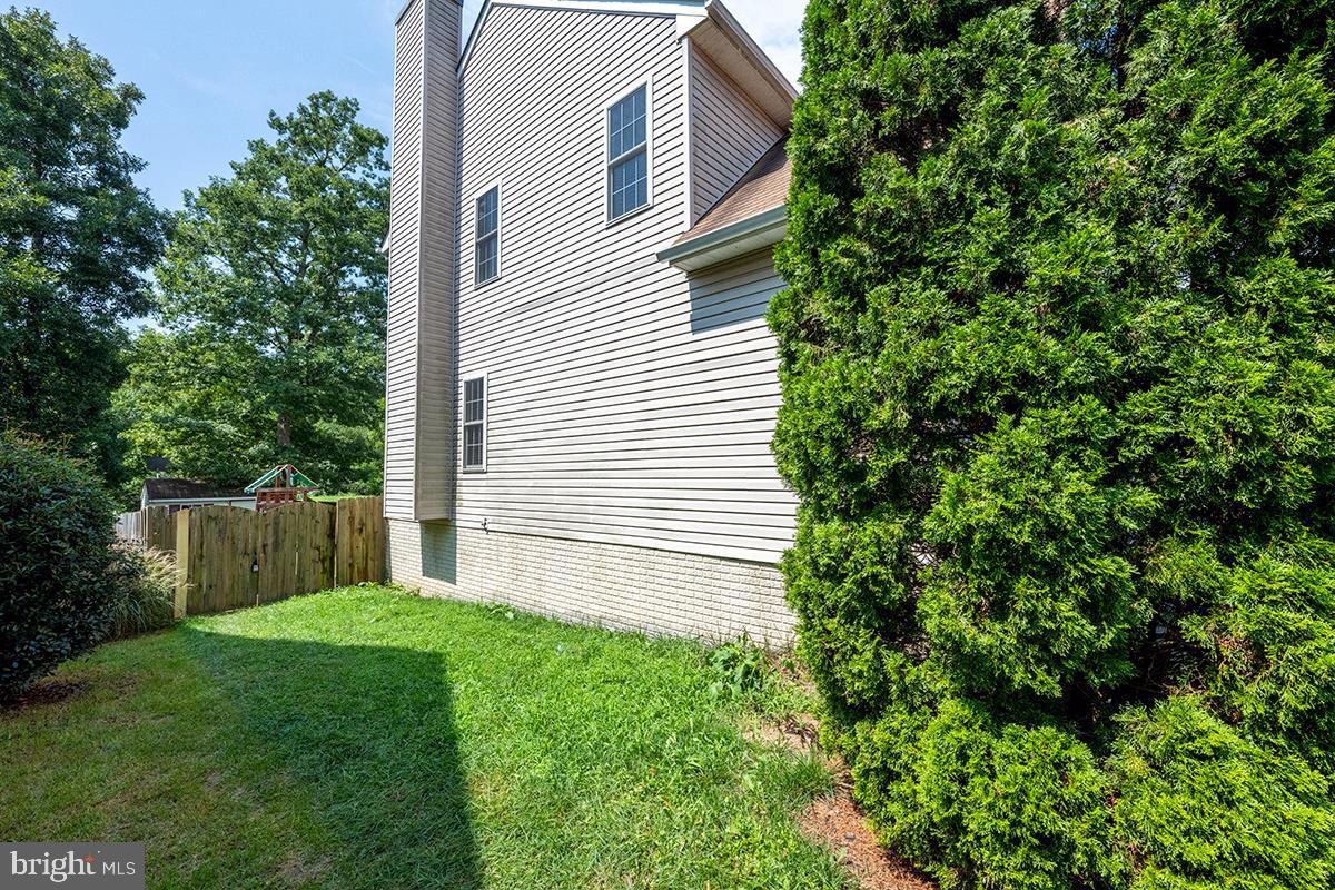35184 Pheasant Ridge Road Locust Grove, VA 22508 - Photo 59 of 64 a view of a backyard with plants and large tree