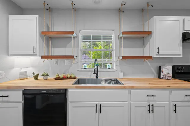 a kitchen with a sink and cabinets