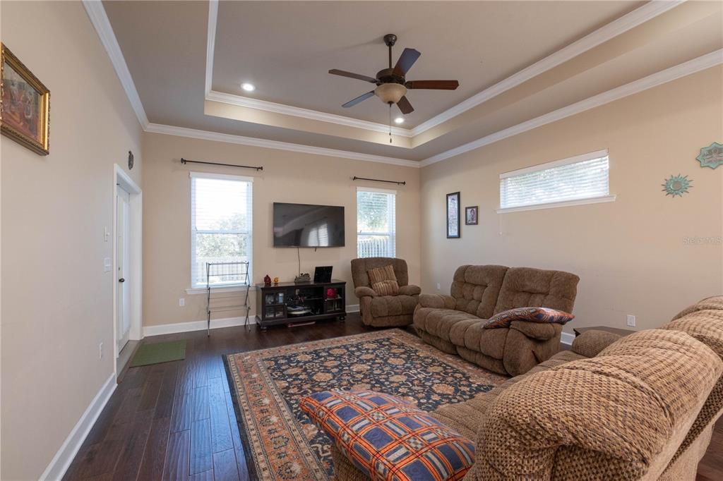 7775 Southwest 80th Drive Gainesville, FL 32608 - Photo 17 of 29 a living room with furniture and a wooden floor