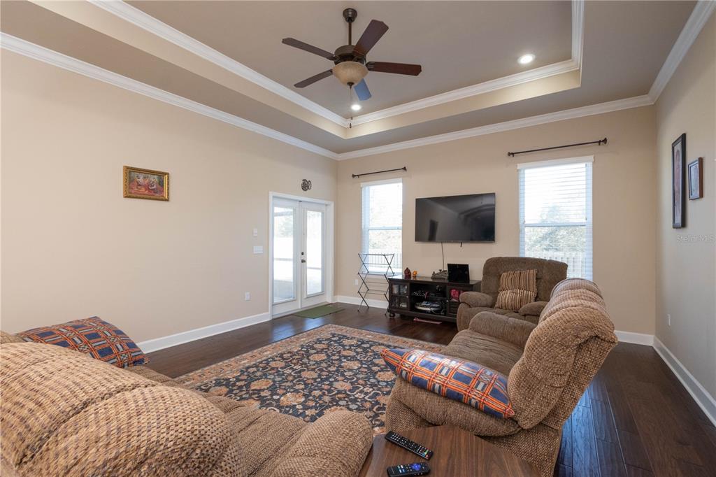 7775 Southwest 80th Drive Gainesville, FL 32608 - Photo 18 of 29 a living room with furniture and a flat screen tv