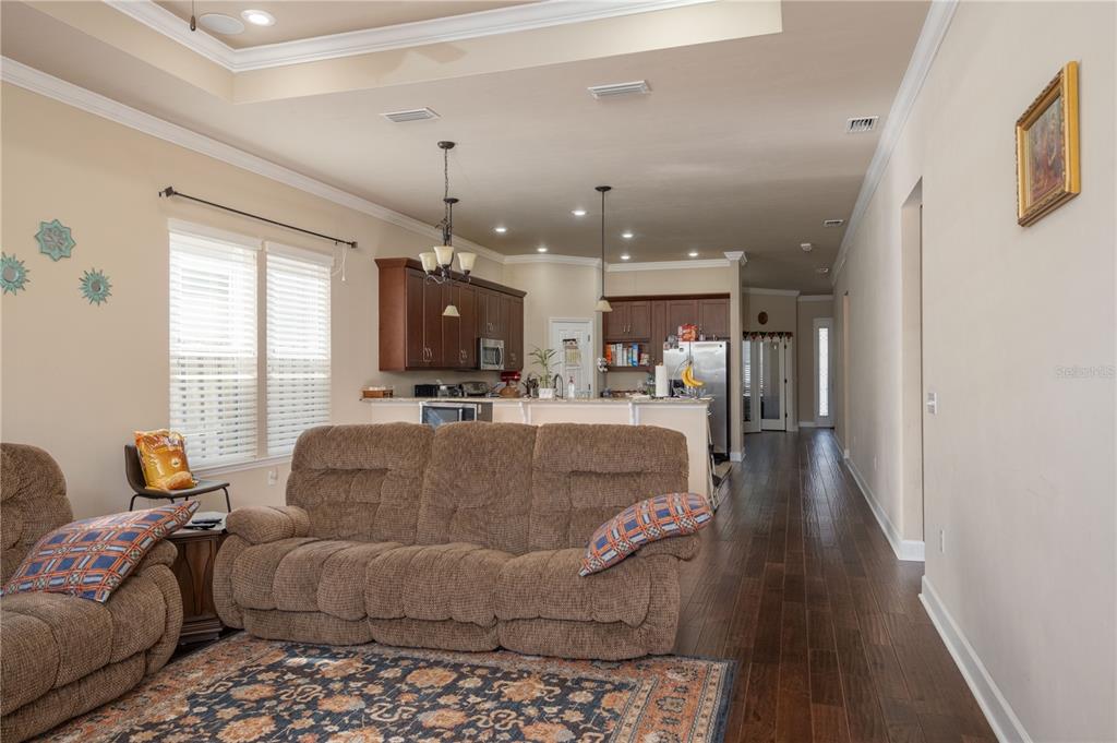 7775 Southwest 80th Drive Gainesville, FL 32608 - Photo 20 of 29 a living room with furniture and kitchen view