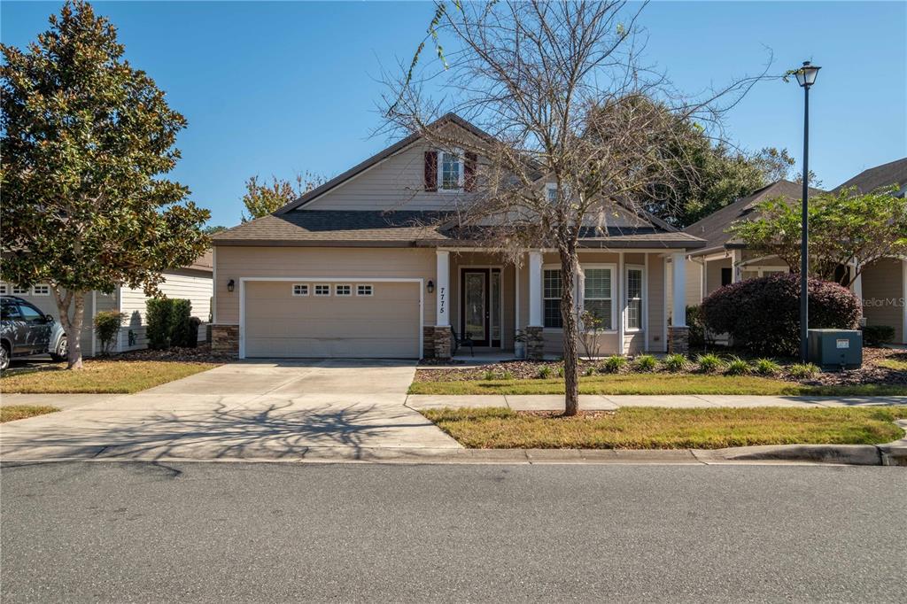 7775 Southwest 80th Drive Gainesville, FL 32608 - Photo 2 of 29 a house that has a tree in front of it