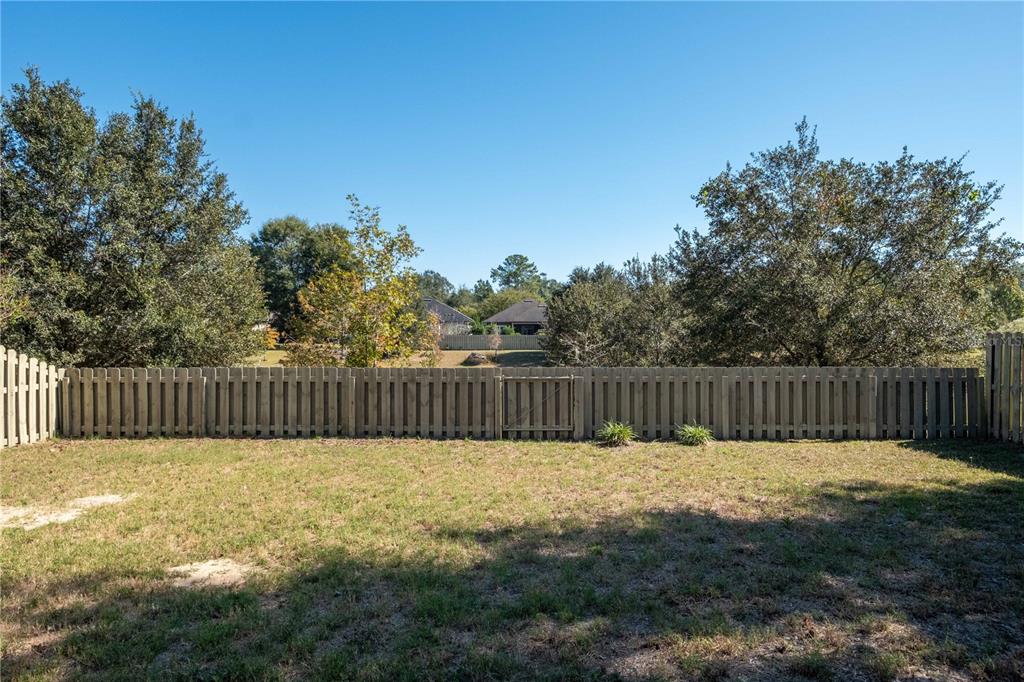 7775 Southwest 80th Drive Gainesville, FL 32608 - Photo 23 of 29 a view of balcony with a fence and trees