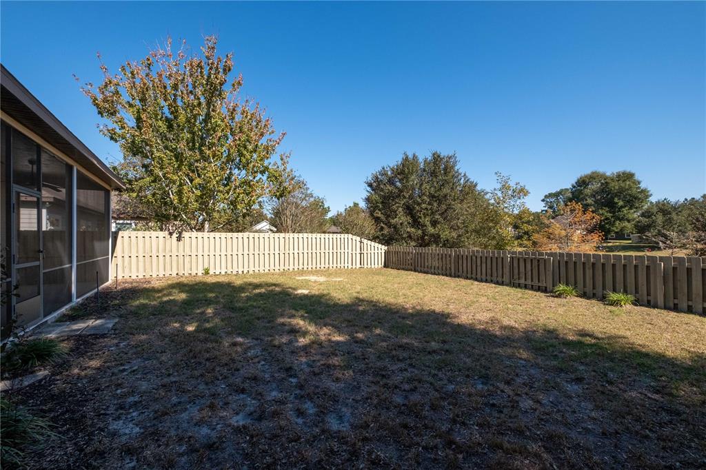 7775 Southwest 80th Drive Gainesville, FL 32608 - Photo 24 of 29 a backyard of a house with lots of green space
