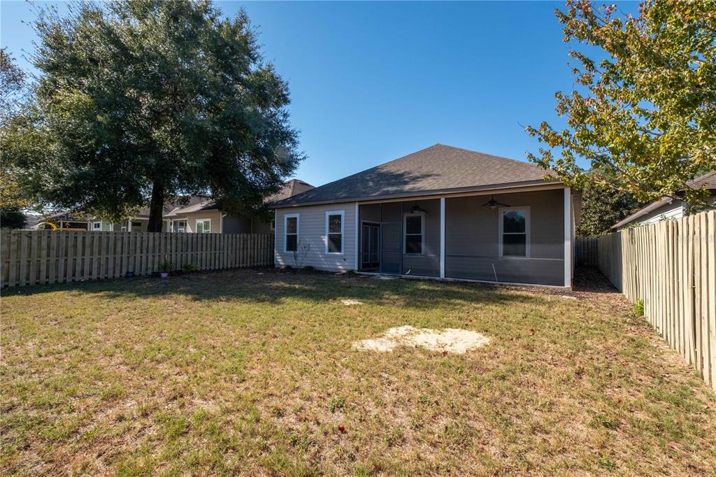 7775 Southwest 80th Drive Gainesville, FL 32608 - Photo 28 of 29 a front view of a house with a yard