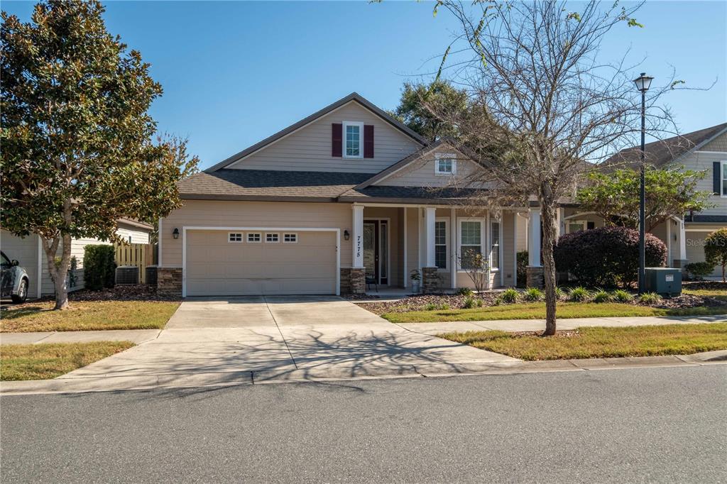 7775 Southwest 80th Drive Gainesville, FL 32608 - Photo 3 of 29 a house with trees in front of it