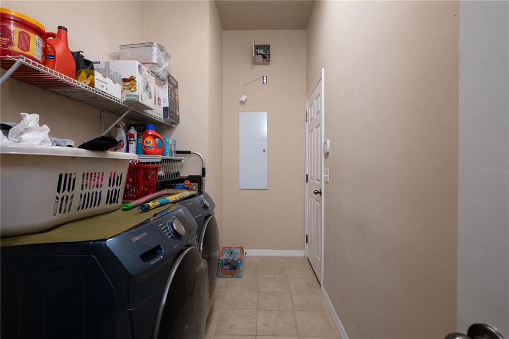 7775 Southwest 80th Drive Gainesville, FL 32608 - Photo 8 of 29 a view of an entryway with wooden floor and toys