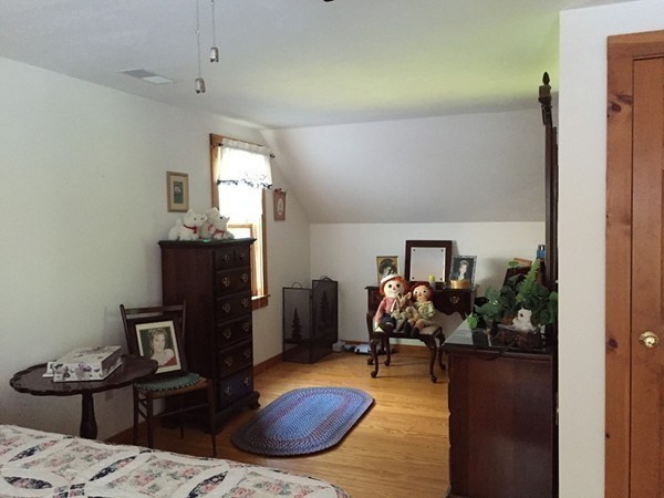 1005 Southbridge Road Warren, MA 01585 - Photo 15 of 30 a bedroom with furniture and a wooden floor