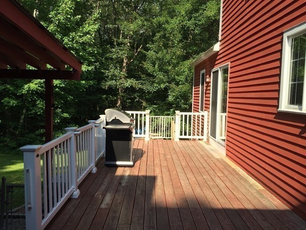 1005 Southbridge Road Warren, MA 01585 - Photo 27 of 30 a view of a wooden deck with a yard