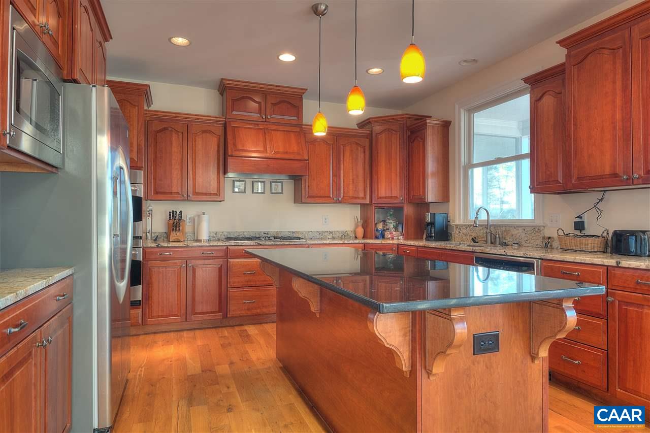 112 Creekside Court Ruckersville, VA 22968 - Photo 11 of 48 a kitchen with stainless steel appliances granite countertop a sink stove and cabinets