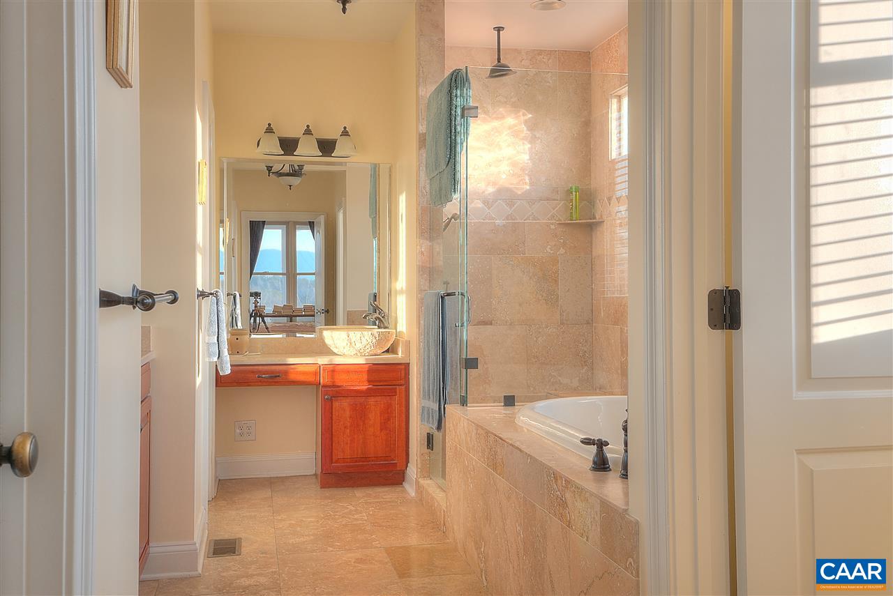 112 Creekside Court Ruckersville, VA 22968 - Photo 18 of 48 a bathroom with a tub shower and sink