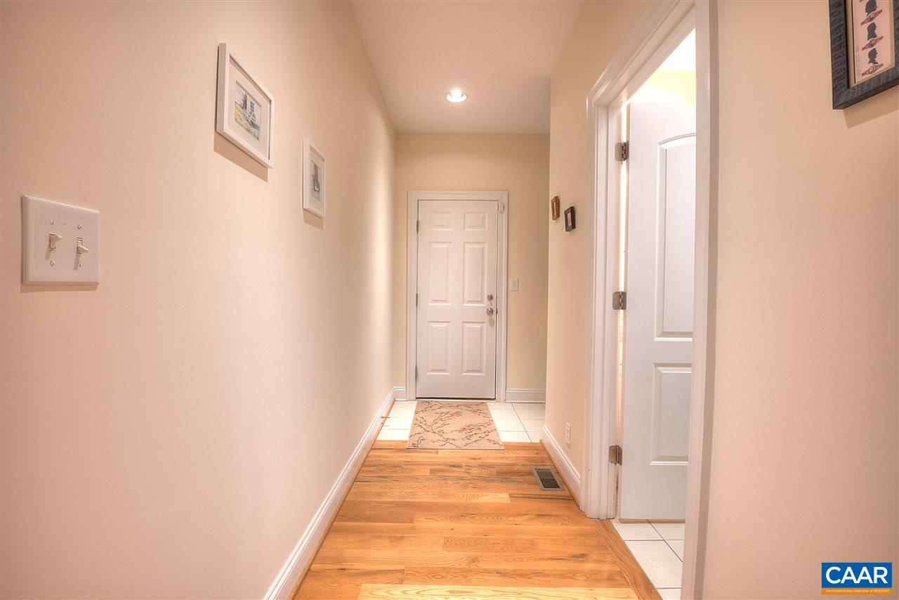 112 Creekside Court Ruckersville, VA 22968 - Photo 23 of 48 a view of a hallway with wooden floor