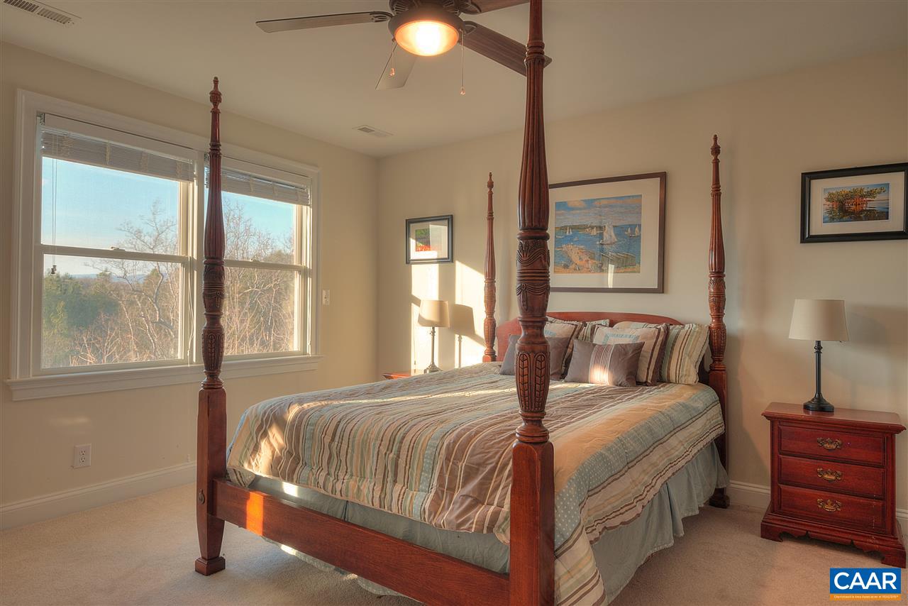 112 Creekside Court Ruckersville, VA 22968 - Photo 28 of 48 a bedroom with a large bed and a window