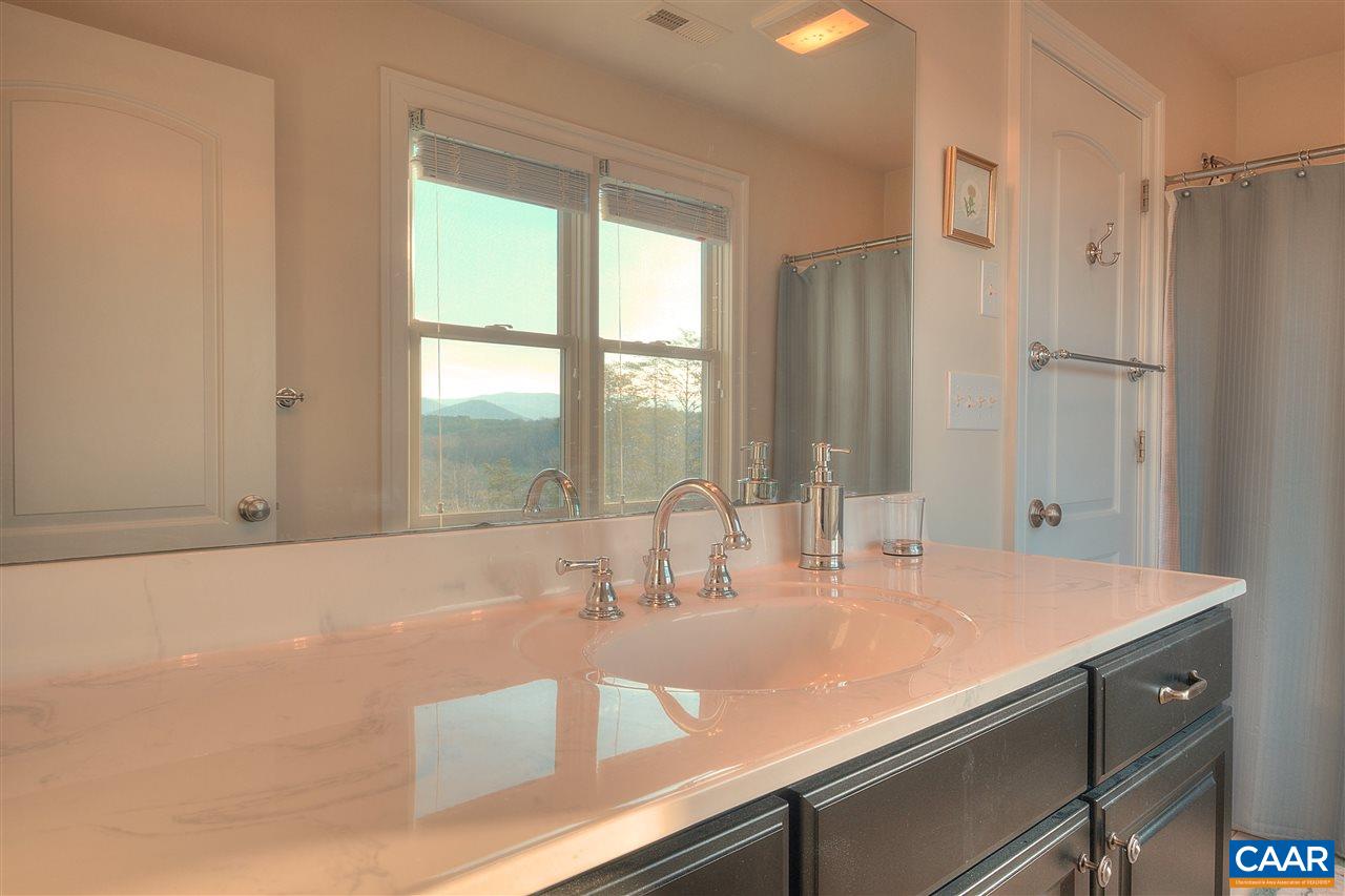 112 Creekside Court Ruckersville, VA 22968 - Photo 31 of 48 a bathroom with a sink and a large mirror