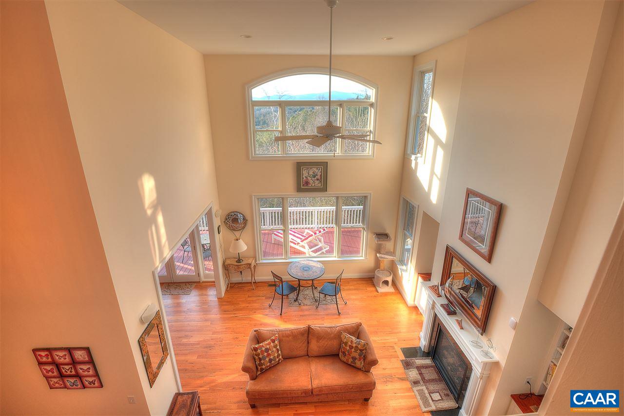 112 Creekside Court Ruckersville, VA 22968 - Photo 38 of 48 a room with furniture and a chandelier