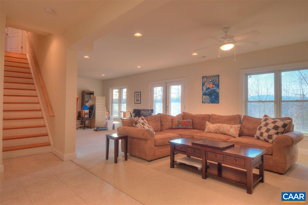 112 Creekside Court Ruckersville, VA 22968 - Photo 39 of 48 a living room with furniture and a large window