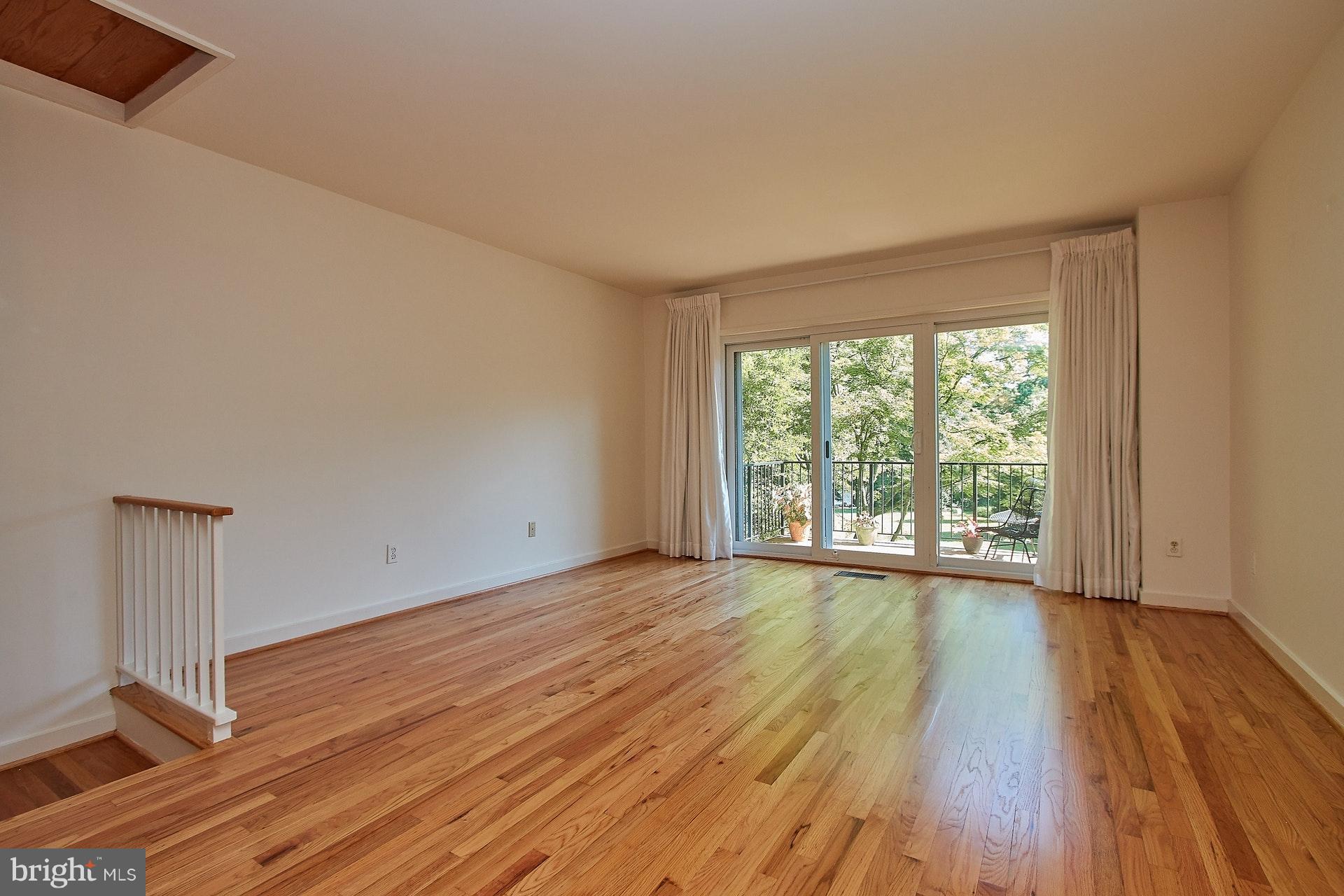 11444 Orchard Lane Reston, VA 20190 - Photo 11 of 30 a view of an empty room with wooden floor and a window