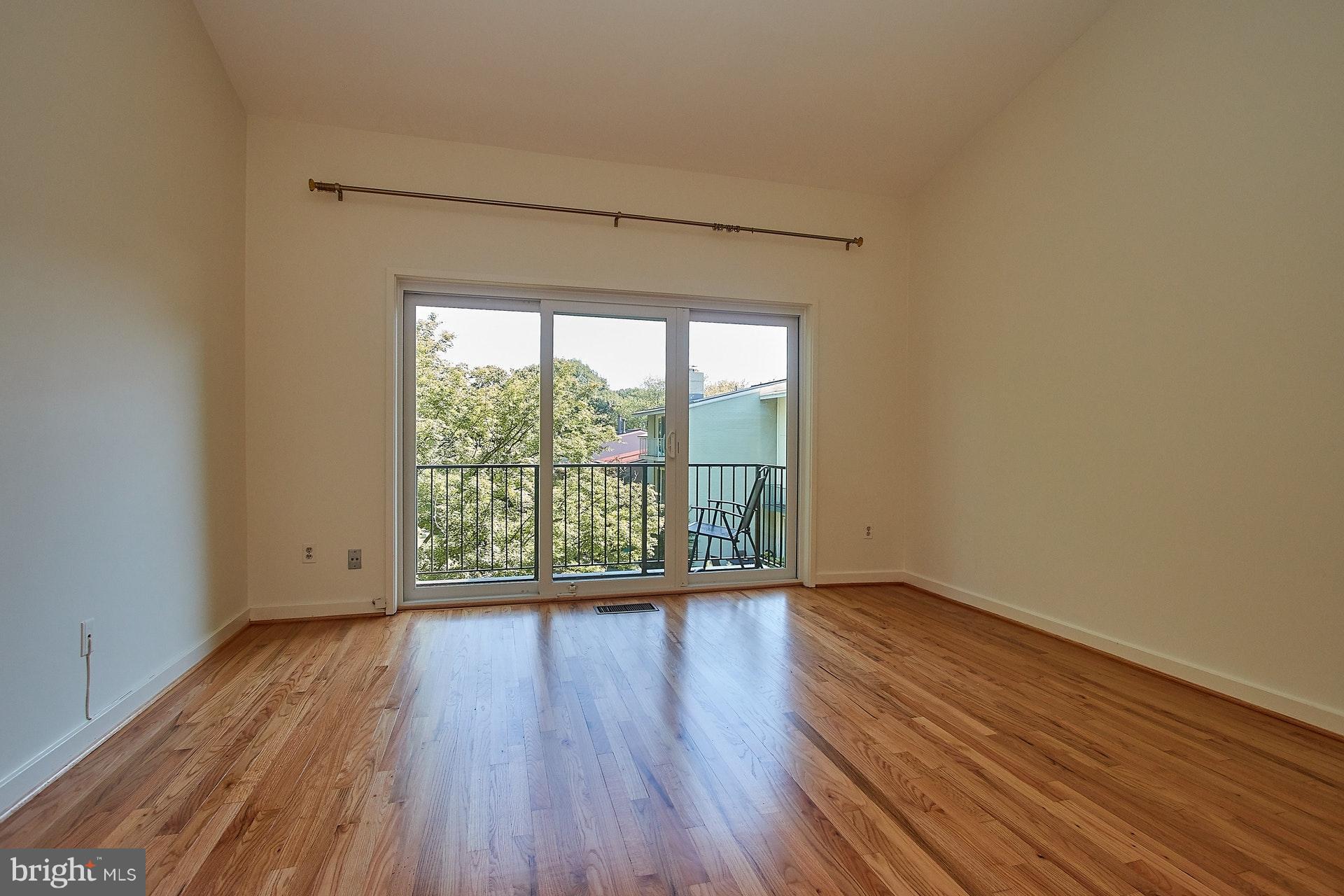 11444 Orchard Lane Reston, VA 20190 - Photo 15 of 30 a view of an empty room with wooden floor and a window