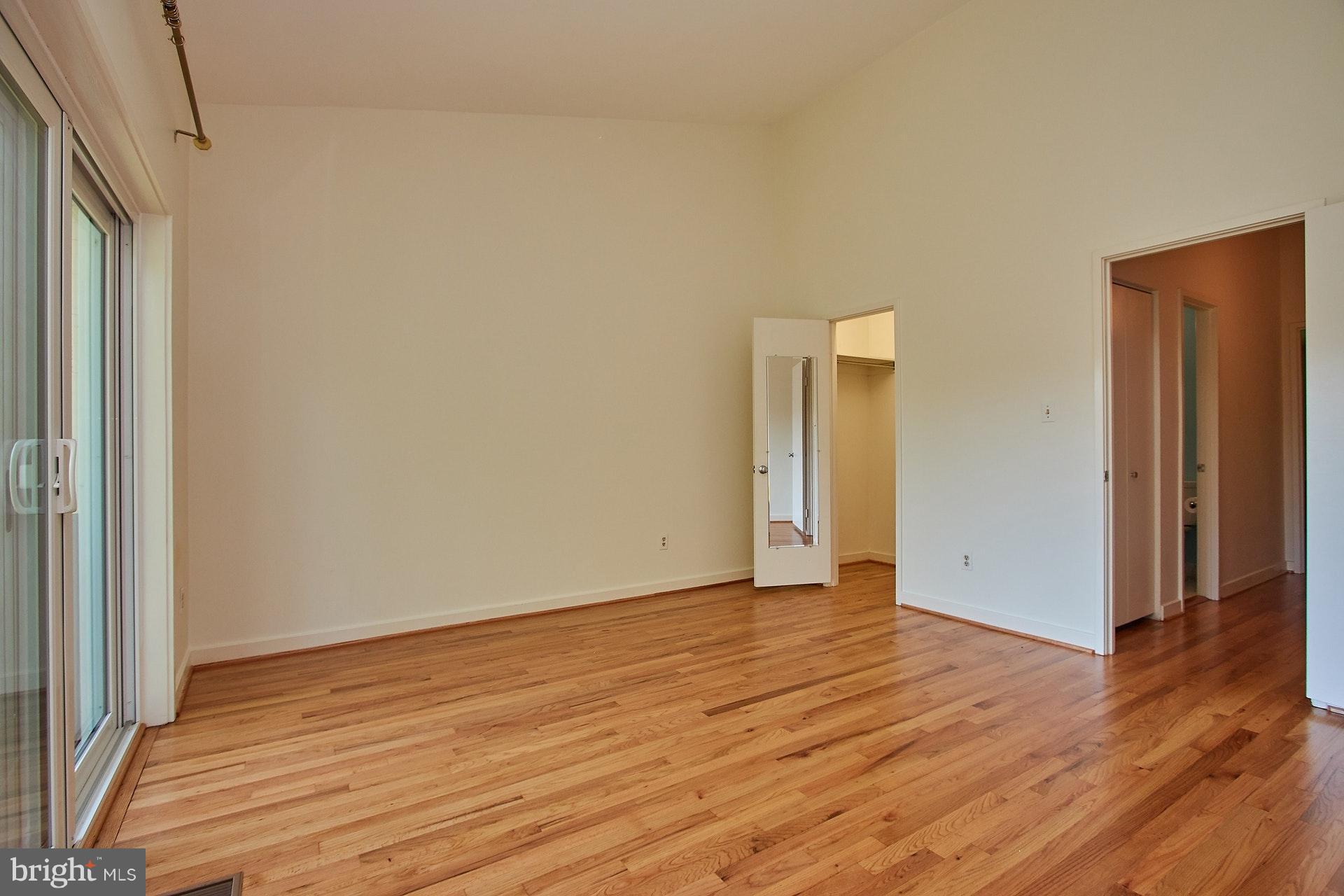 11444 Orchard Lane Reston, VA 20190 - Photo 16 of 30 a view of an empty room with wooden floor and a window