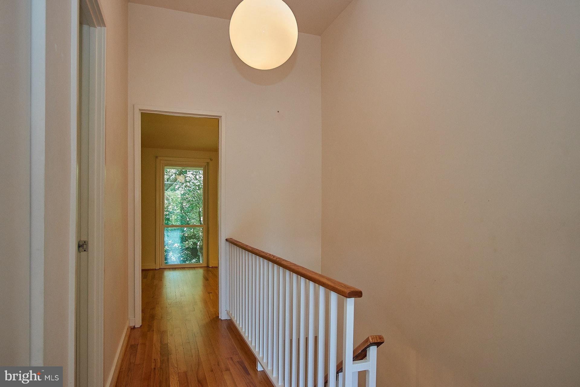 11444 Orchard Lane Reston, VA 20190 - Photo 17 of 30 a view of a hallway with wooden floor