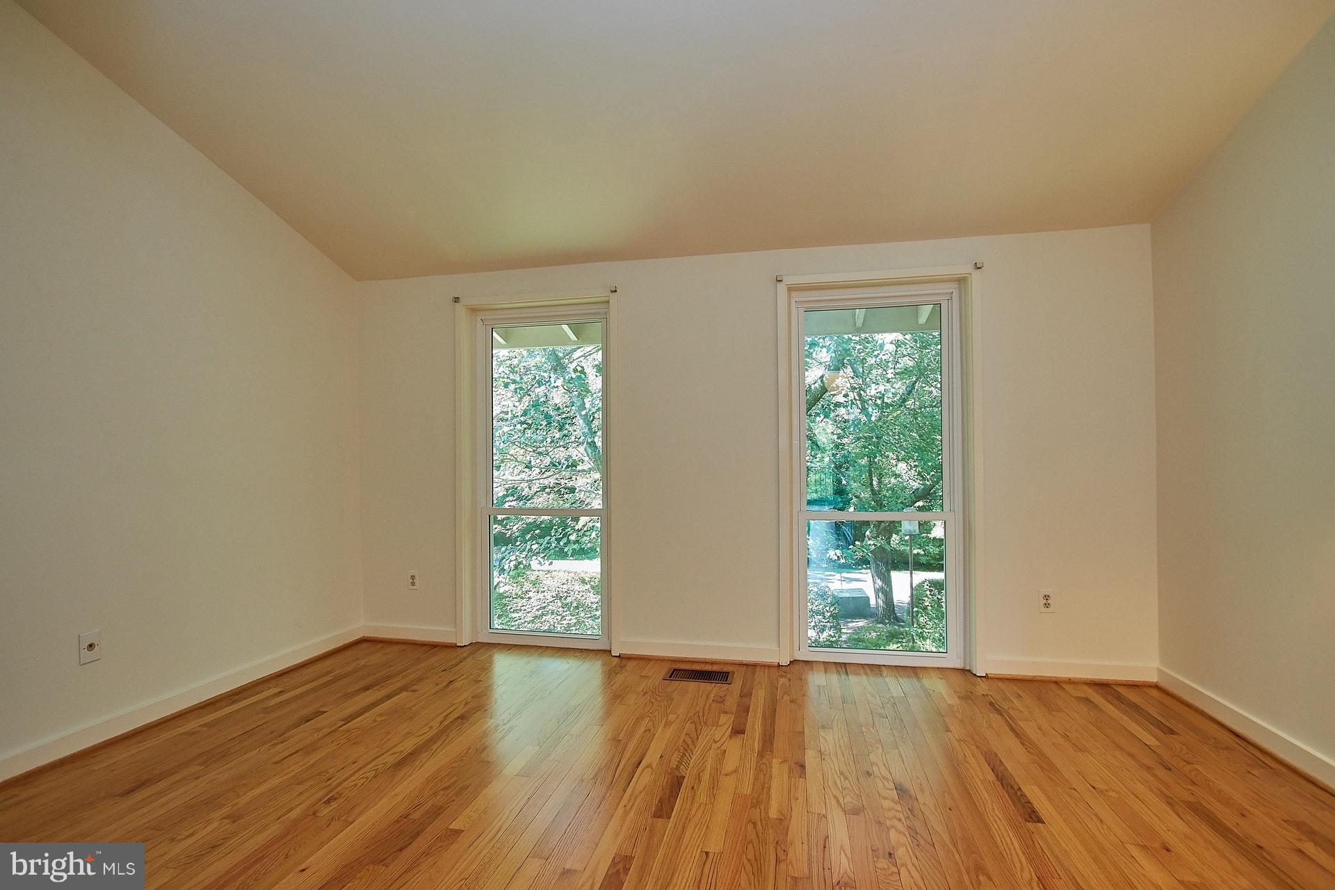 11444 Orchard Lane Reston, VA 20190 - Photo 19 of 30 an empty room with wooden floor and windows