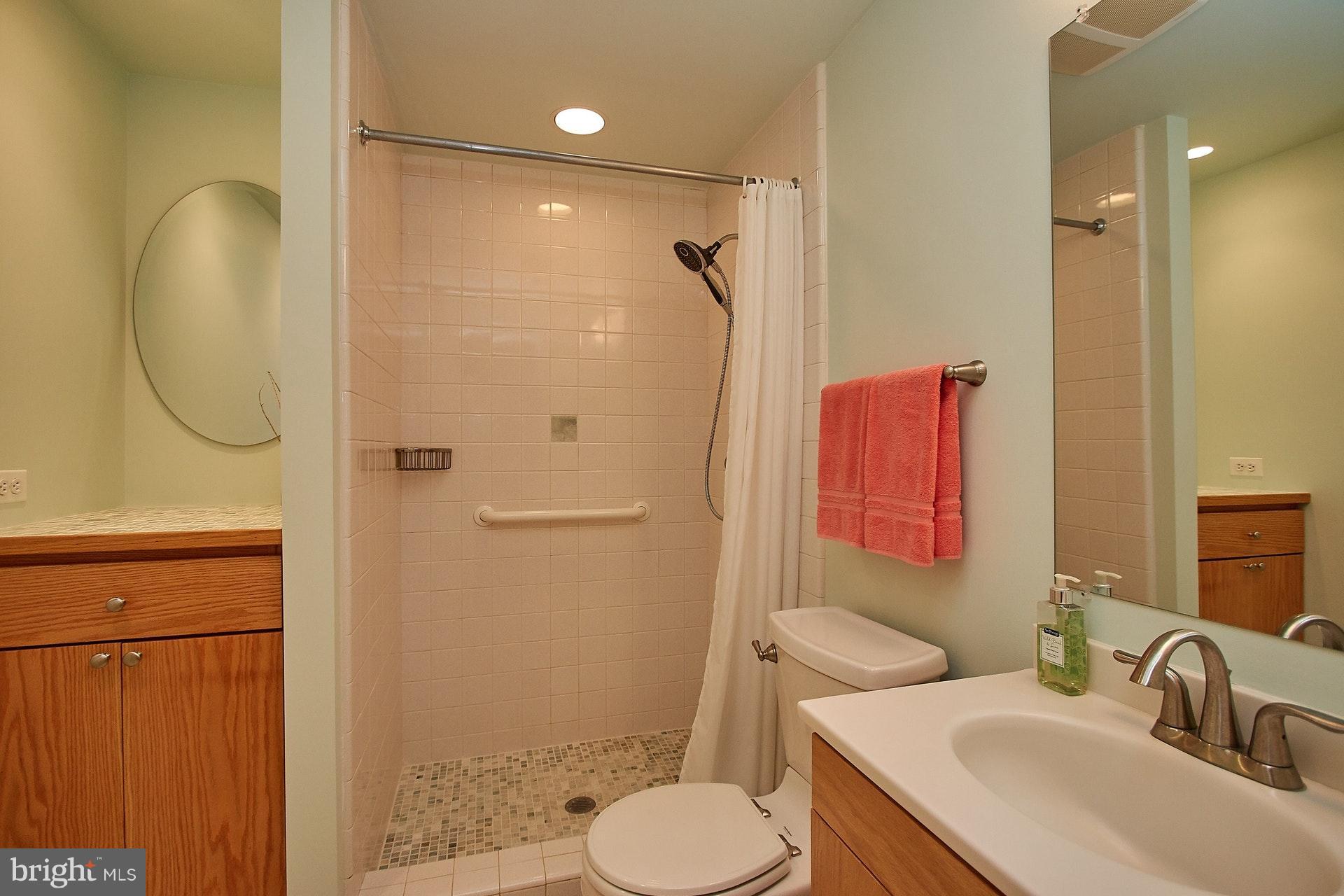 11444 Orchard Lane Reston, VA 20190 - Photo 23 of 30 a bathroom with a sink toilet and shower