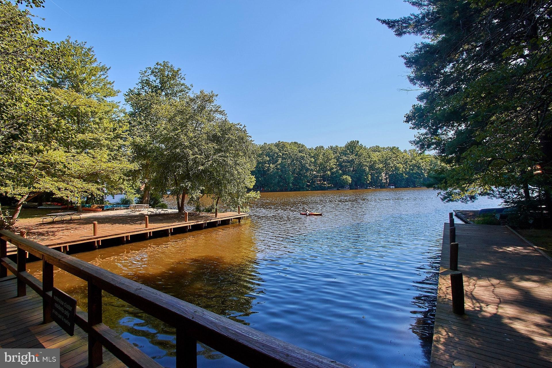 11444 Orchard Lane Reston, VA 20190 - Photo 28 of 30 a view of a lake with wooden stairs and outdoor seating