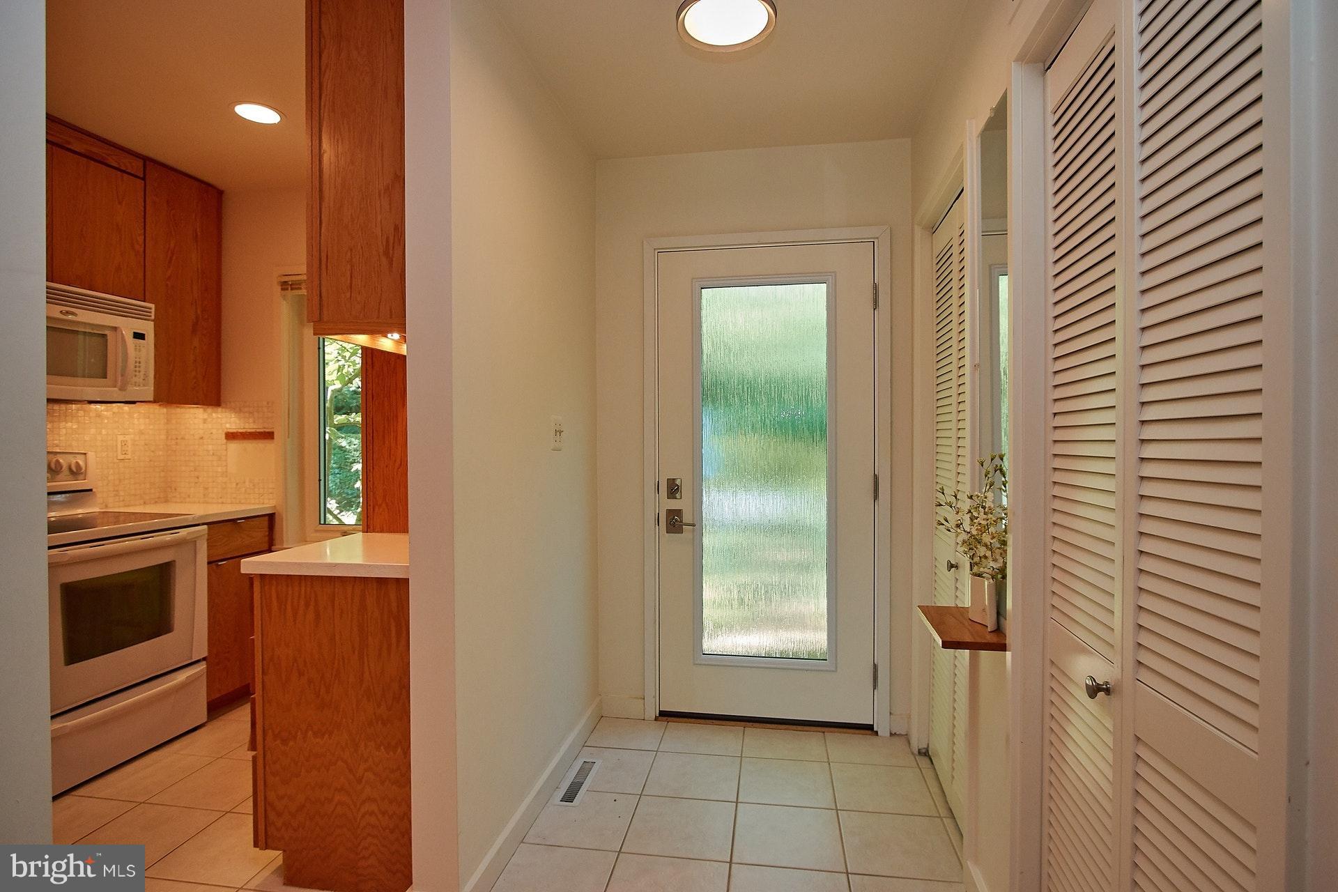 11444 Orchard Lane Reston, VA 20190 - Photo 4 of 30 a kitchen with a refrigerator and a stove top oven
