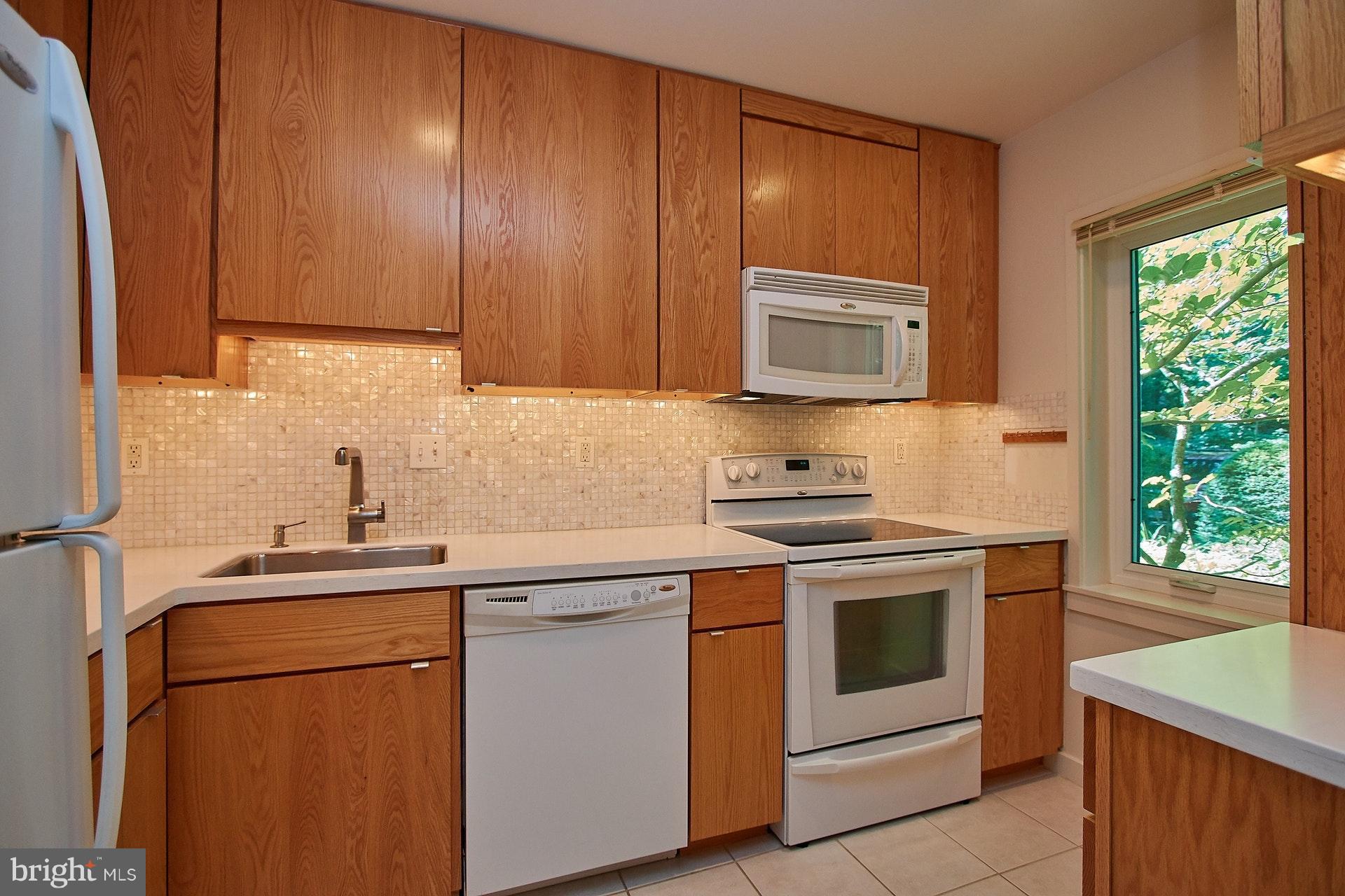 11444 Orchard Lane Reston, VA 20190 - Photo 5 of 30 a kitchen with a sink stove and cabinets