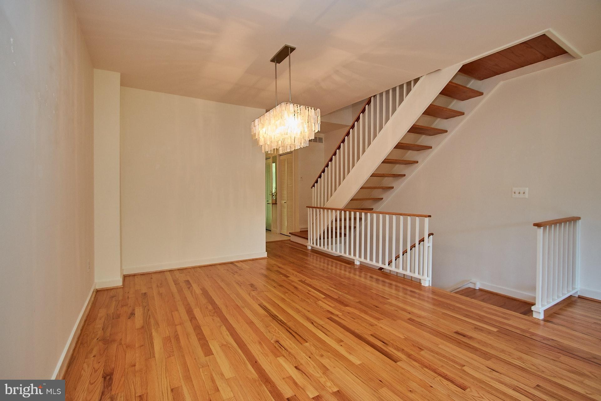 11444 Orchard Lane Reston, VA 20190 - Photo 10 of 30 a view of a room with wooden floor and staircase