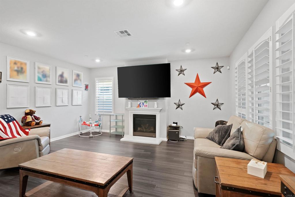 33009 Marin Fields Road Winchester, CA 92596 - Photo 11 of 51 a living room with furniture fireplace and flat screen tv