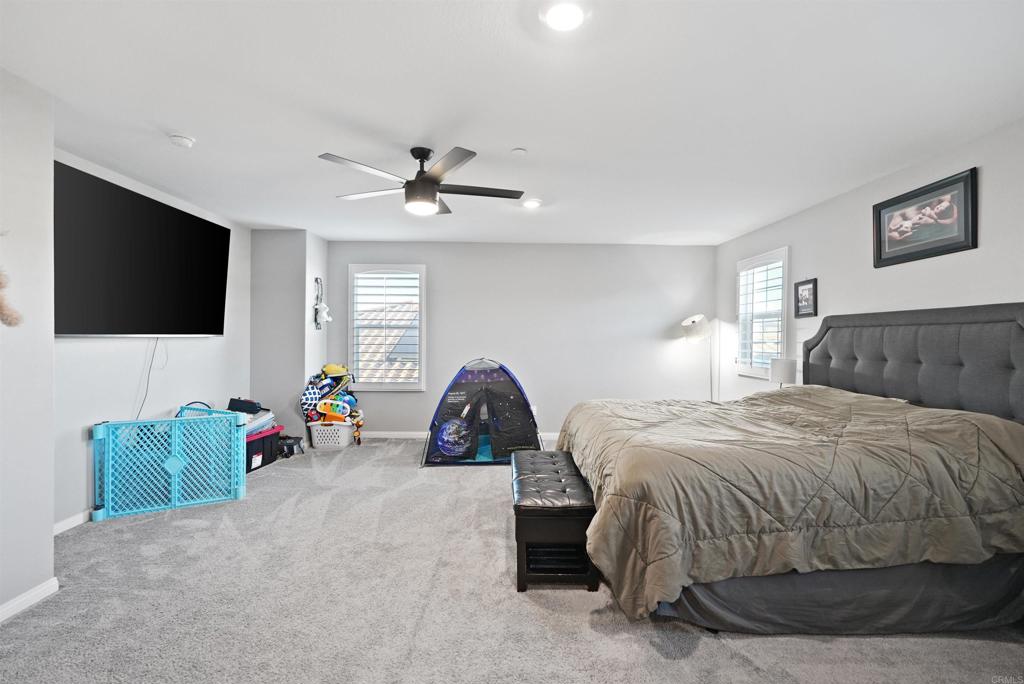 33009 Marin Fields Road Winchester, CA 92596 - Photo 24 of 51 a bedroom with bed tv and a window