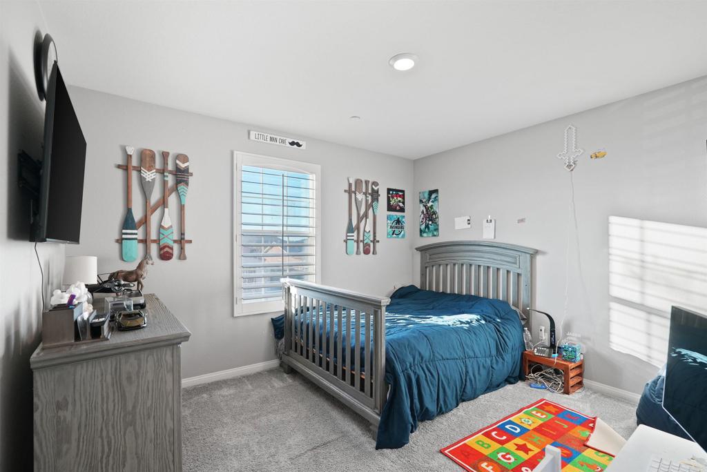 33009 Marin Fields Road Winchester, CA 92596 - Photo 32 of 51 a bedroom with furniture and a window