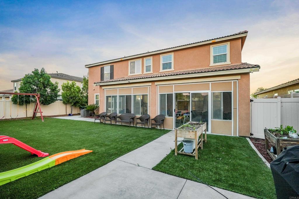33009 Marin Fields Road Winchester, CA 92596 - Photo 39 of 51 a front view of a house with a yard table and chairs