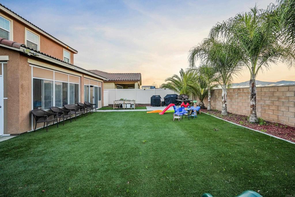 33009 Marin Fields Road Winchester, CA 92596 - Photo 42 of 51 a front view of a house with garden