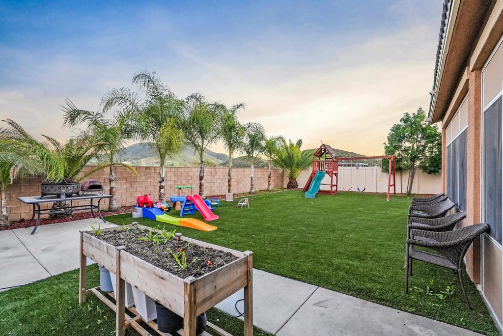 33009 Marin Fields Road Winchester, CA 92596 - Photo 43 of 51 a view of a table and chairs in a garden