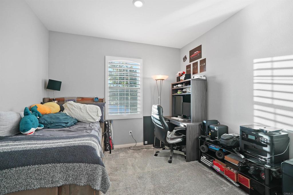 33009 Marin Fields Road Winchester, CA 92596 - Photo 8 of 51 a bedroom with a bed and a window