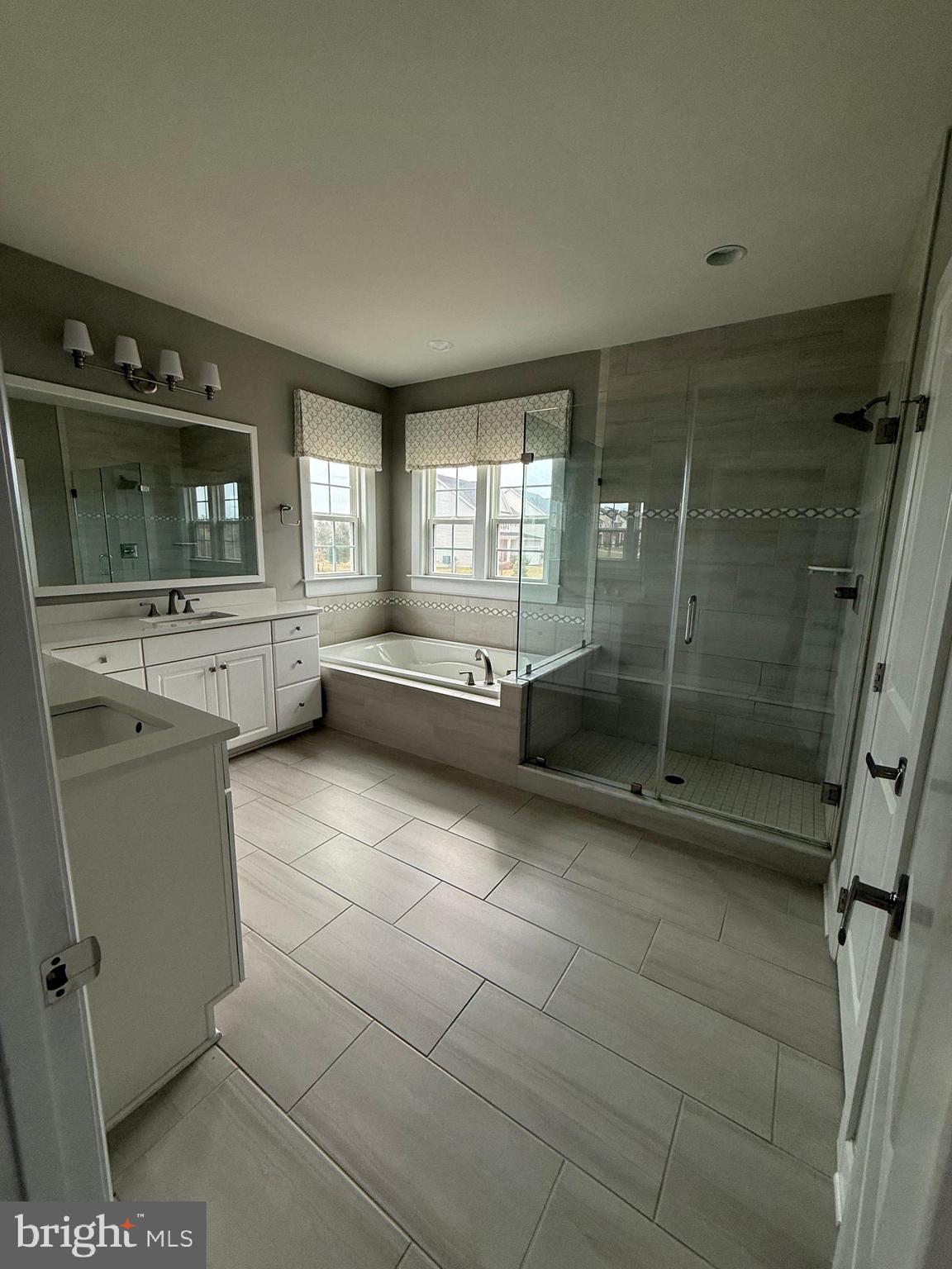 2575 Bailey Circle Philadelphia, PA 19115 - Photo 15 of 36 a large en suite bathroom with a bathtub and mirror