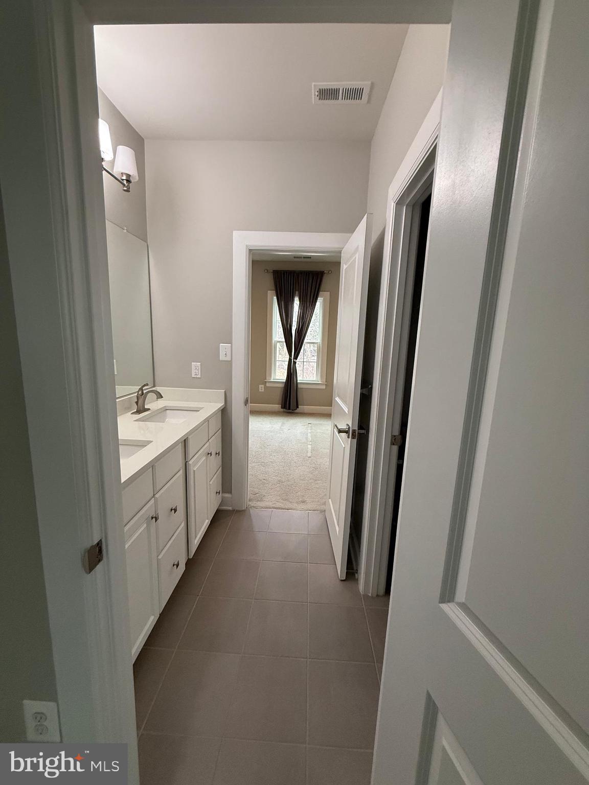 2575 Bailey Circle Philadelphia, PA 19115 - Photo 21 of 36 a bathroom with a double vanity sink and mirror