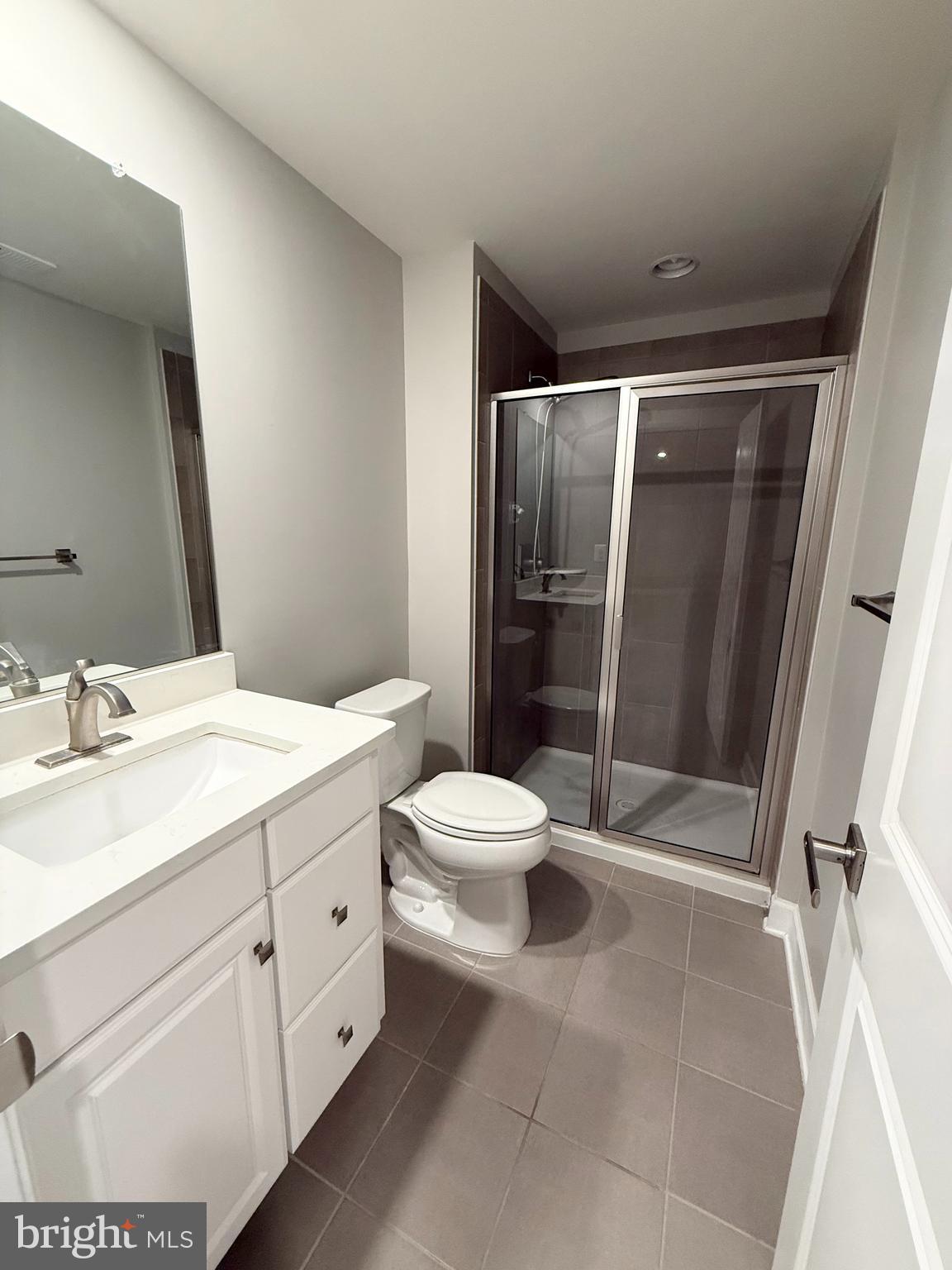 2575 Bailey Circle Philadelphia, PA 19115 - Photo 27 of 36 a bathroom with a sink a toilet a mirror and shower