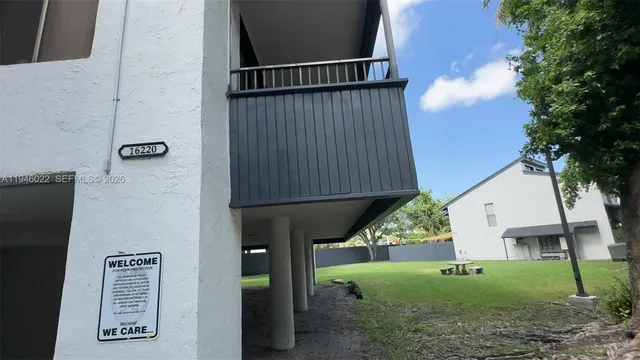 a view of a car parked in front of a house